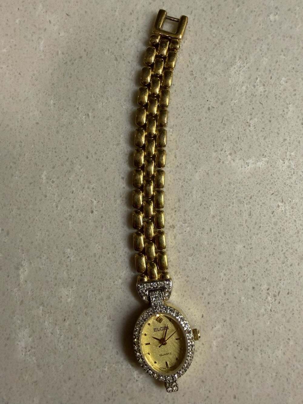 Elgin Women's Gold Tone Oval Quartz Watch with Rhinestone Bezel